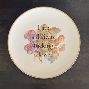 Decorative Plate with Floral Design and Text